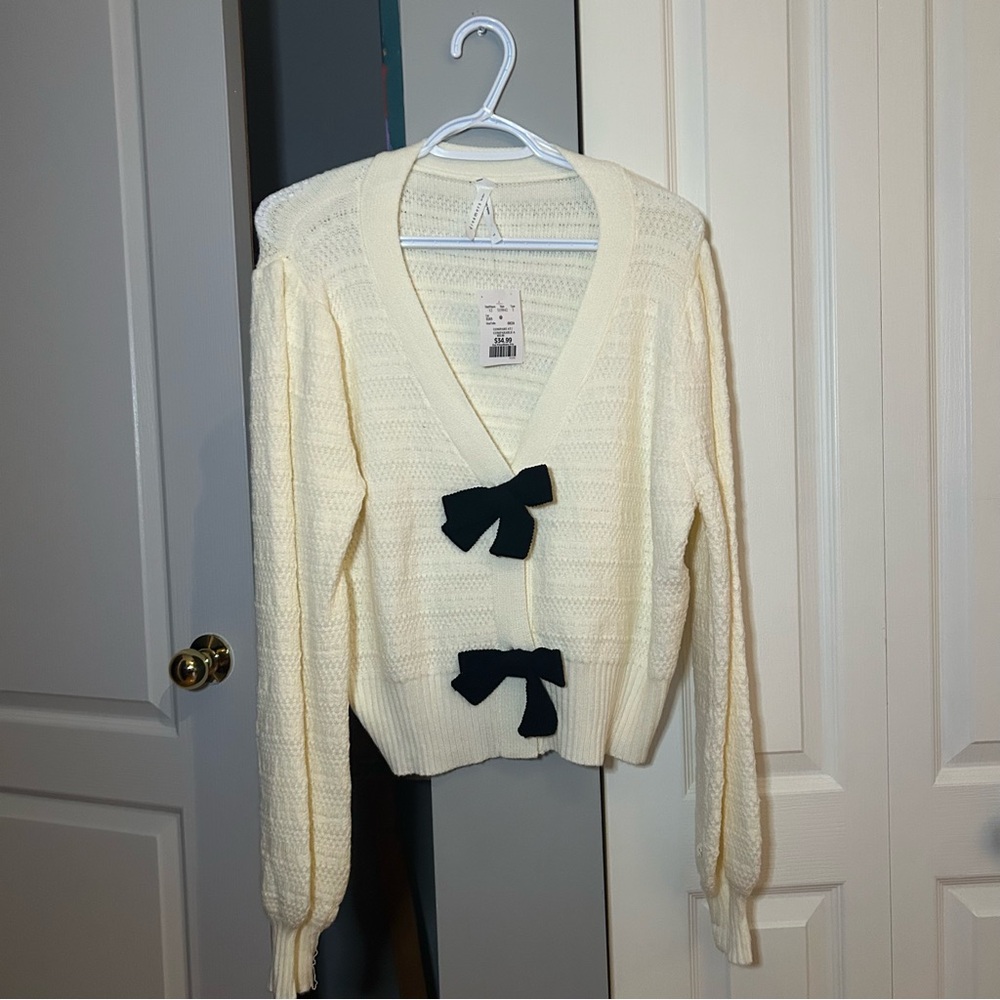 45 Dreamers Cream Cardigan with Black Bow Accents